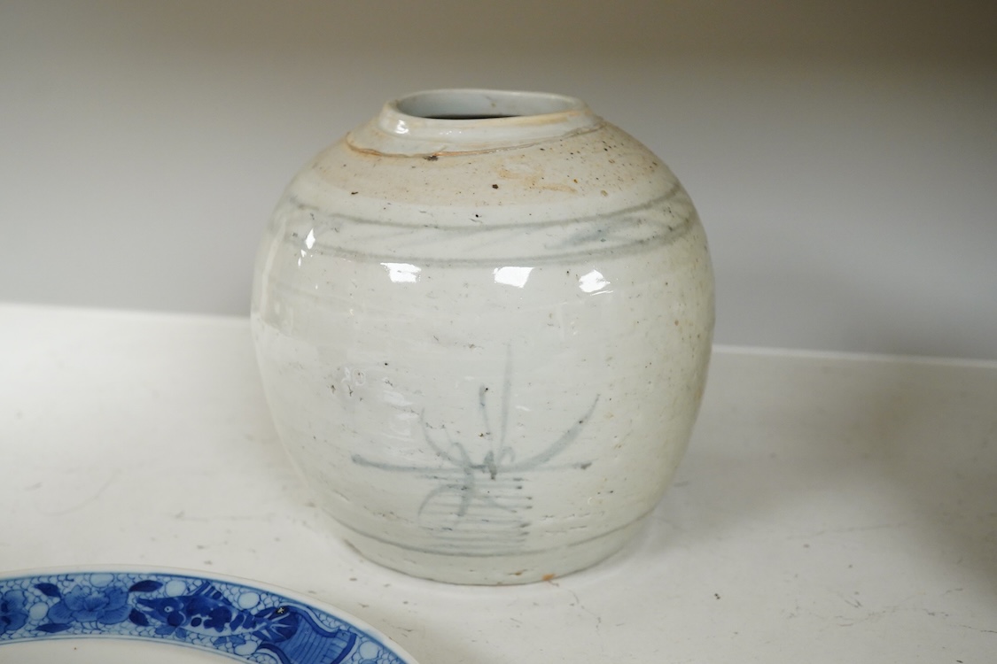 A 19th Century Chinese blue and white ‘precious objects’ plate, a jar and famille rose saucer, largest 23cm in diameter